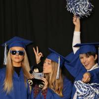 funny picture of three students with photobooth props